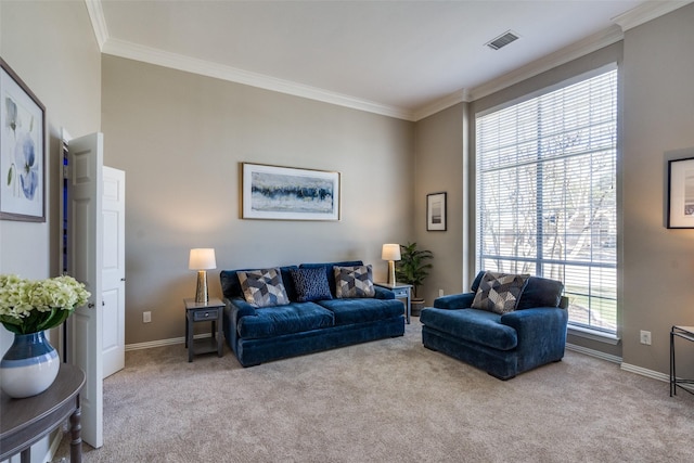 carpeted living room featuring baseboards, visible vents, and crown molding