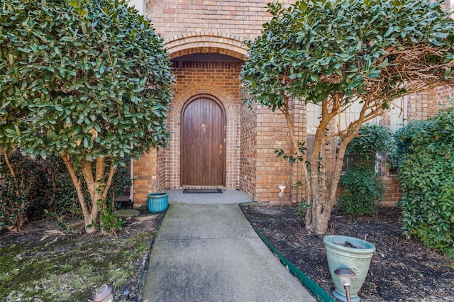 property entrance with brick siding