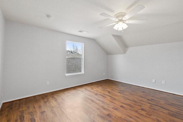 bonus room featuring ceiling fan, visible vents, vaulted ceiling, and wood finished floors