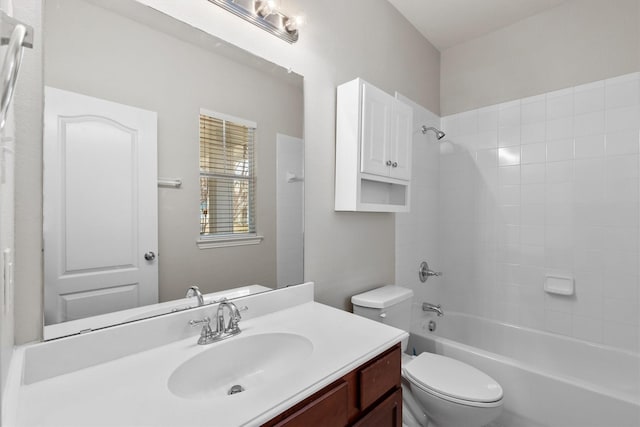 bathroom featuring vanity, bathtub / shower combination, and toilet