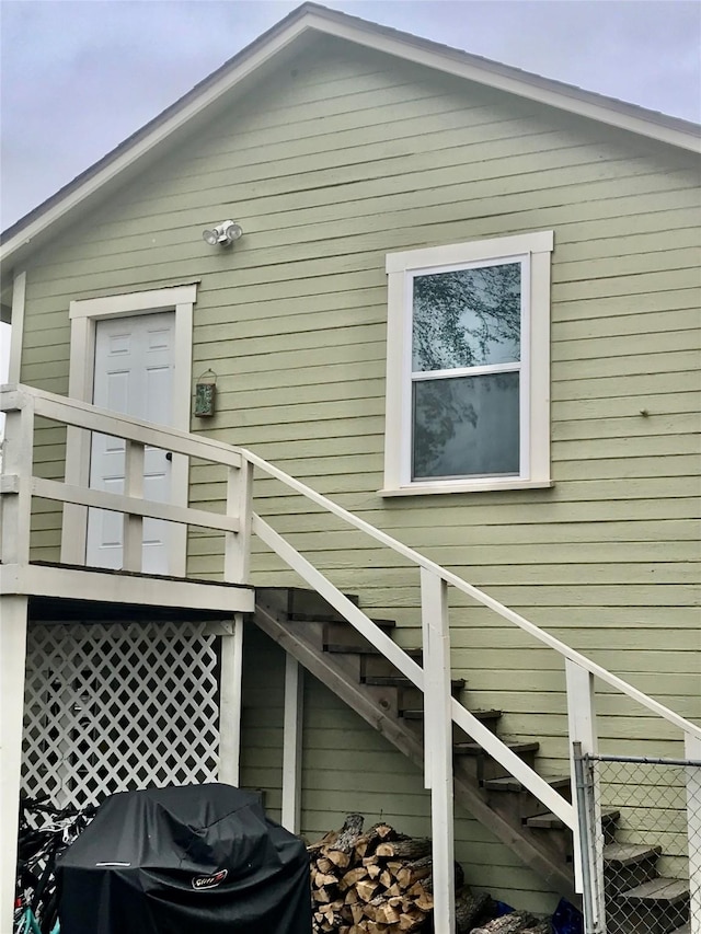 view of home's exterior featuring stairs