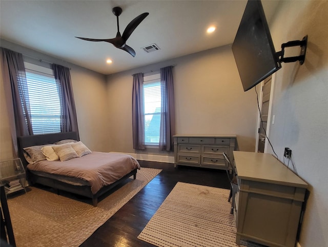 bedroom featuring dark wood-style floors, visible vents, a ceiling fan, and recessed lighting