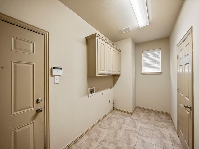 washroom featuring hookup for a gas dryer, washer hookup, visible vents, cabinet space, and electric dryer hookup