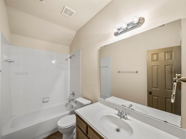 full bath with visible vents, toilet, vaulted ceiling, vanity, and  shower combination