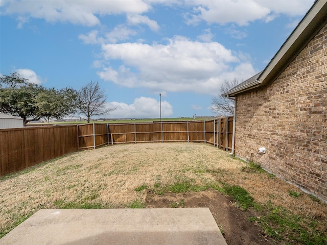 view of yard with a fenced backyard