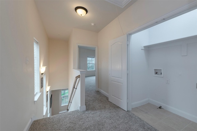 laundry area featuring hookup for a washing machine, attic access, light carpet, laundry area, and baseboards