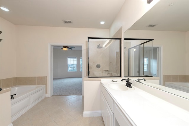 full bathroom with a stall shower, visible vents, a garden tub, and vanity