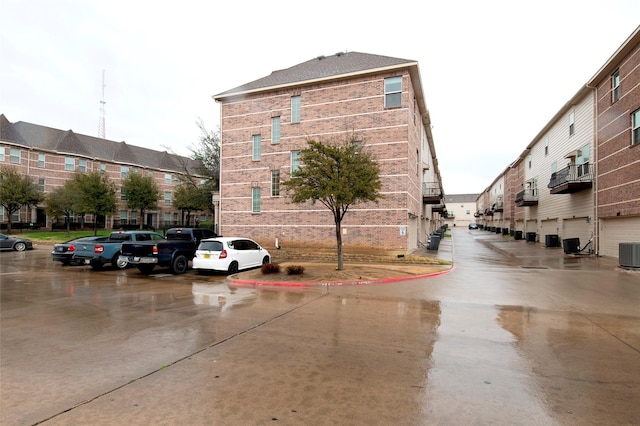 view of building exterior with central air condition unit