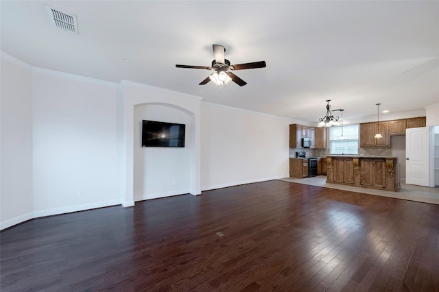 unfurnished living room with ornamental molding, visible vents, dark wood finished floors, and baseboards