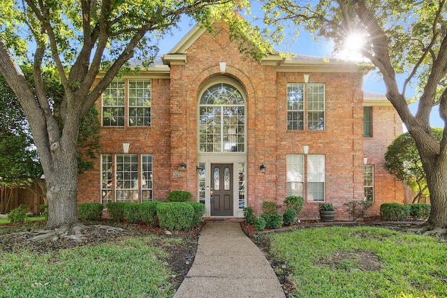 view of front of home featuring brick siding