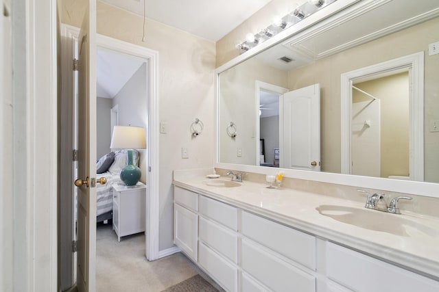 ensuite bathroom with visible vents, a sink, ensuite bath, and walk in shower