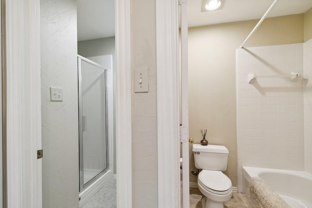 bathroom with toilet, a bathing tub, and a shower with door