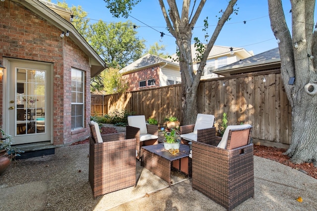 view of patio / terrace featuring fence