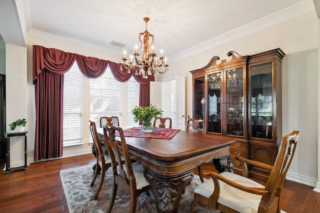 dining space featuring a notable chandelier, visible vents, baseboards, ornamental molding, and dark wood finished floors