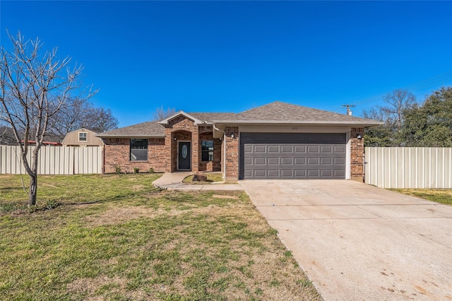 ranch-style home with brick siding, concrete driveway, fence, a garage, and a front lawn