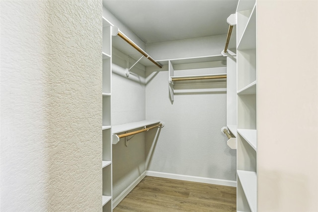 spacious closet with wood finished floors