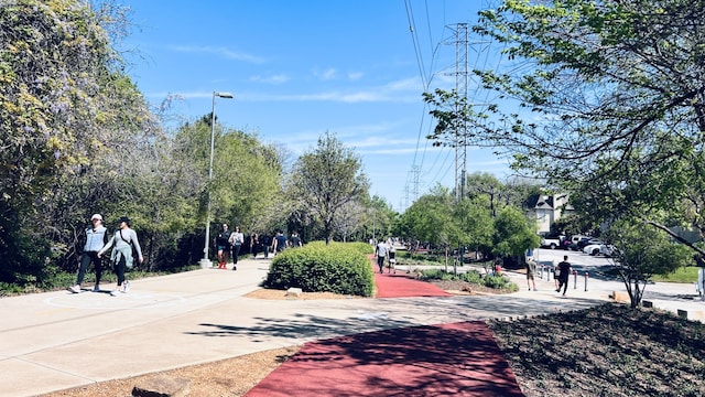 view of road with street lights and sidewalks