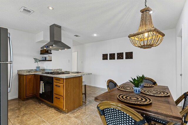 kitchen featuring visible vents, brown cabinets, black appliances, island exhaust hood, and a peninsula