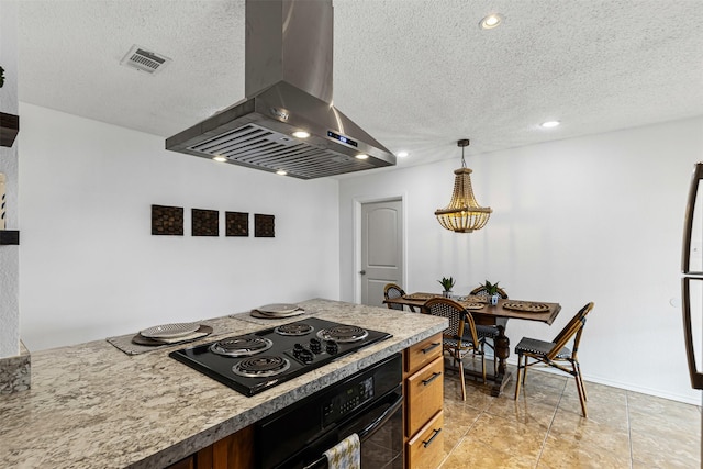 kitchen featuring visible vents, oven, a textured ceiling, wall chimney exhaust hood, and black electric cooktop