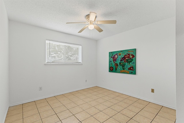 unfurnished room featuring a textured ceiling and a ceiling fan