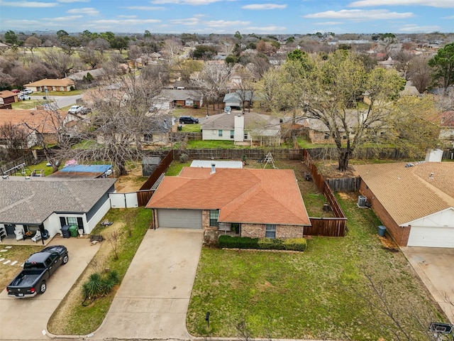 birds eye view of property with a residential view