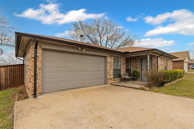 single story home featuring a garage, brick siding, driveway, and fence