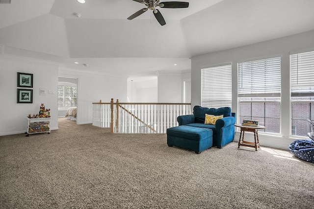 living area with vaulted ceiling, carpet flooring, an upstairs landing, and baseboards