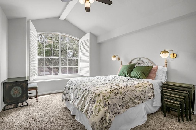 bedroom with lofted ceiling with beams, ceiling fan, baseboards, and carpet flooring