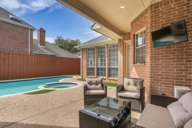 view of patio featuring an outdoor hangout area, an in ground hot tub, fence, and a fenced in pool