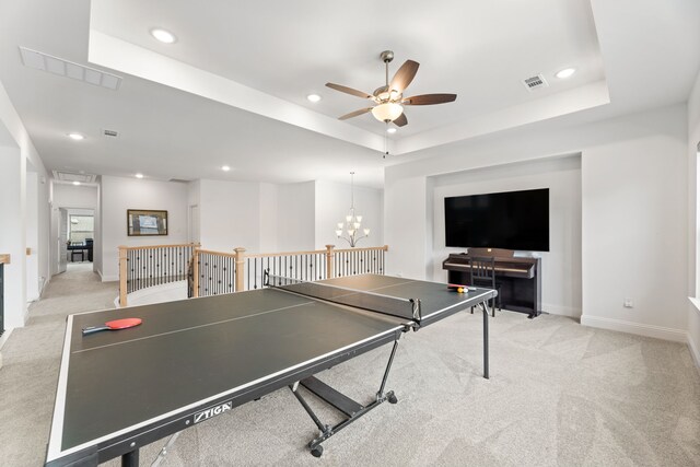 rec room with light colored carpet, ceiling fan with notable chandelier, recessed lighting, baseboards, and visible vents
