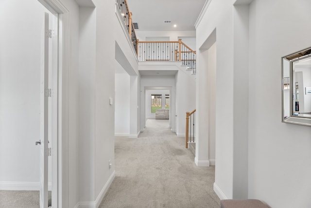 corridor with baseboards, recessed lighting, carpet, and visible vents