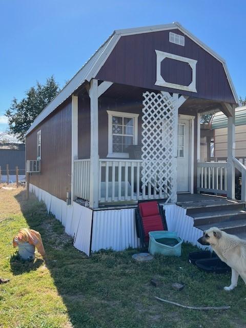 view of home's exterior featuring covered porch