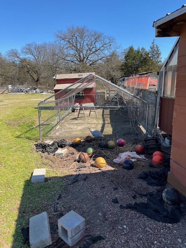 view of yard with exterior structure and an outdoor structure