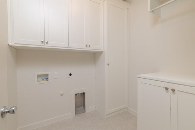 laundry room with washer hookup, light tile patterned floors, cabinet space, hookup for an electric dryer, and gas dryer hookup