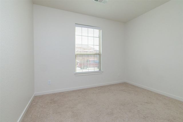 empty room with carpet floors and baseboards