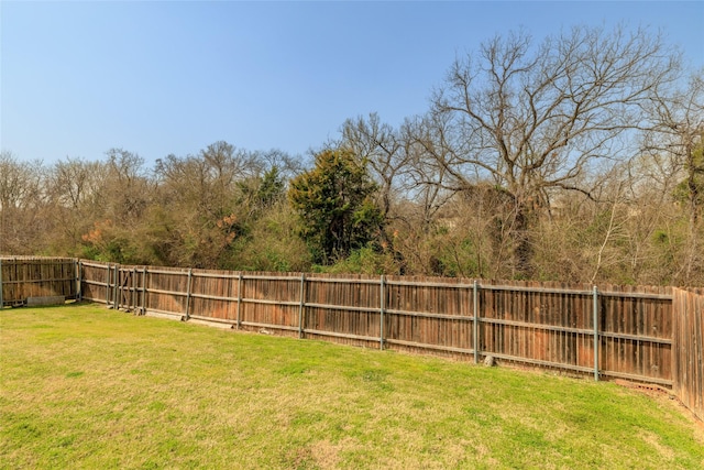 view of yard with a fenced backyard