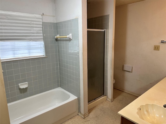 full bath with a sink, a shower stall, a bathing tub, and double vanity