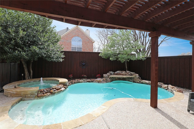 view of swimming pool with a patio, a fenced backyard, and a pool with connected hot tub