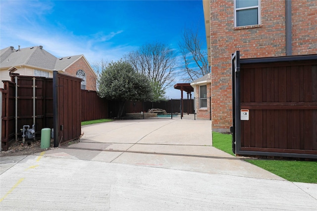 exterior space featuring a patio and fence