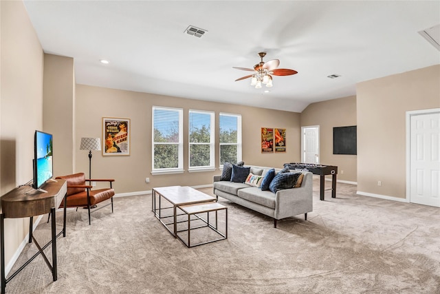 living room featuring visible vents, light carpet, baseboards, and ceiling fan