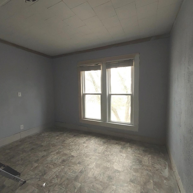 unfurnished room with tile patterned floors