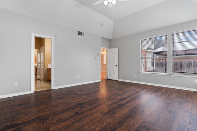 unfurnished bedroom with lofted ceiling, wood finished floors, a ceiling fan, visible vents, and baseboards