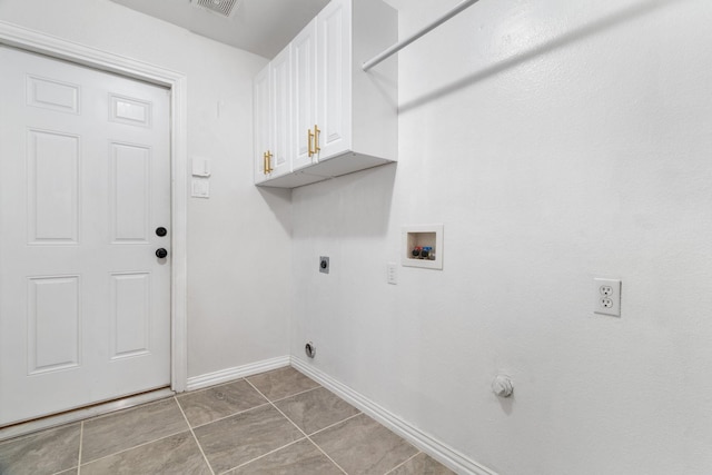 washroom with washer hookup, visible vents, baseboards, cabinet space, and electric dryer hookup