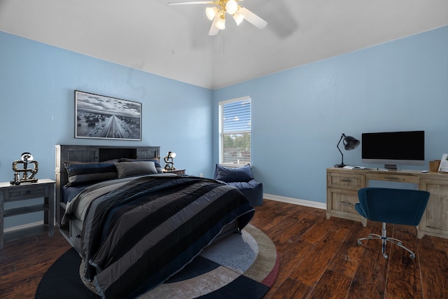 bedroom with vaulted ceiling, ceiling fan, wood finished floors, and baseboards