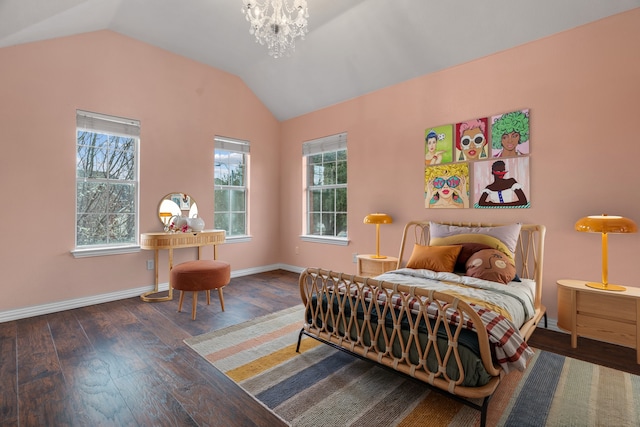 bedroom with lofted ceiling, wood-type flooring, a chandelier, and baseboards