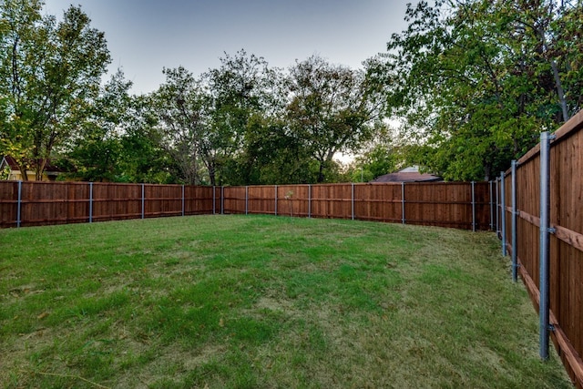 view of yard featuring a fenced backyard