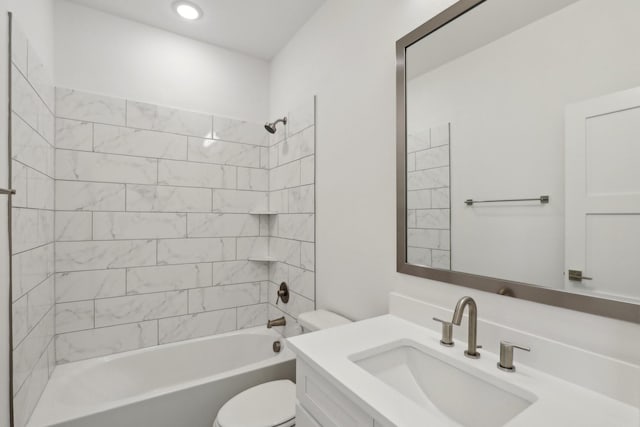 bathroom featuring bathing tub / shower combination, vanity, and toilet