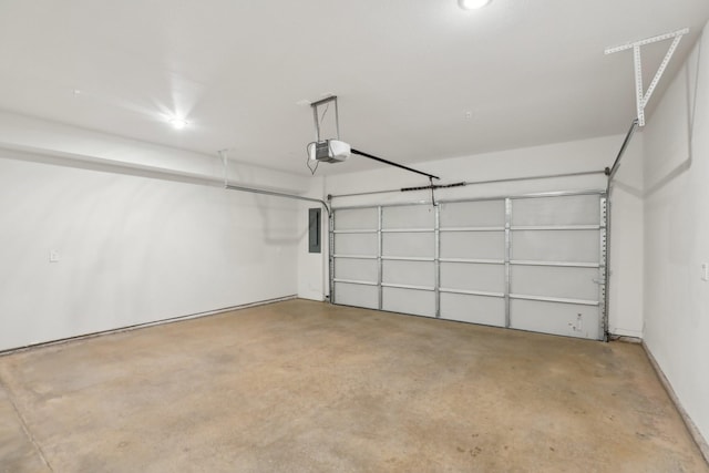 garage with electric panel and a garage door opener