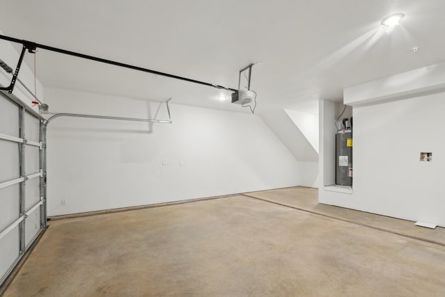 garage featuring water heater and a garage door opener