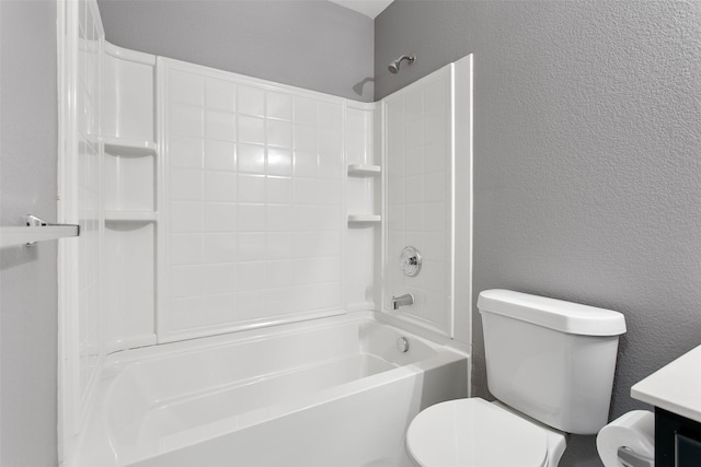 full bath with toilet, bathtub / shower combination, vanity, and a textured wall